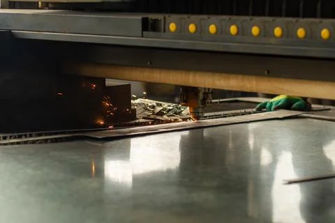 Precision Metal Cutting Process with Sparks from Laser Technology in a Manu.. Stock Photos