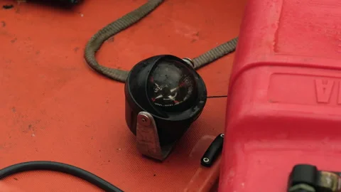 Precision Nautical Compass on an Orange Rescue Lifeboat Pointing North Stock Footage 330857652