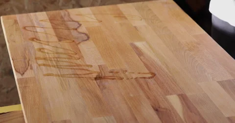 Precision oiling of wood board via syringe Stock Footage 332664129
