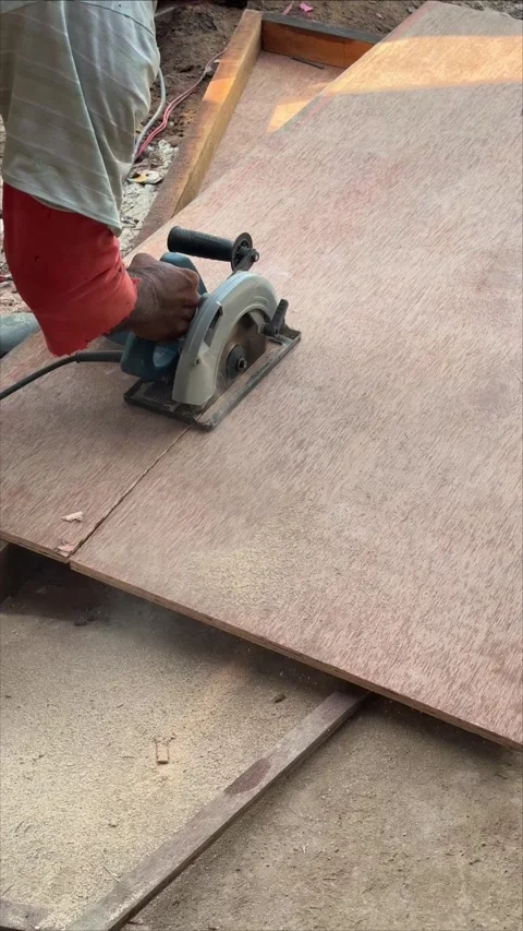 Precision Panel Fabrication: Mastering Wood Cutting with a Handheld Circula.. Video stock 337286838