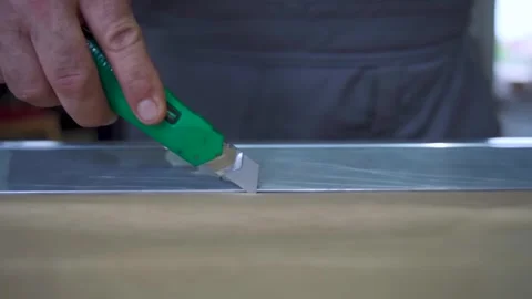 Precision Paper Cutting with Utility Knife. The image shows precise, detailed wo Stock Footage 294263704