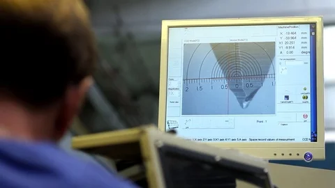 Precision part processing under a video microscope Stockbeeldmateriaal 75545760