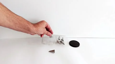 Precision in Pastry: Hand Showcases Gleaming Decorating Nozzles 스톡 동영상 314365480