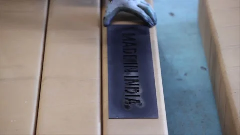 A precision in process in an industrial the being spray-painted onto long Stock Footage 332587127