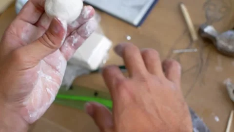 Precision in Progress  Sculptor s Hands with Knife on Clay Video stock 260842860