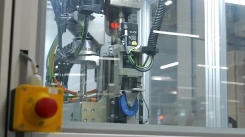 Precision robotic assembly machine and emergency stop in high tech factory Stock Footage 328644896
