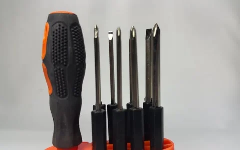 Precision screwdriver set with interchangeable bits in orange holder Stock Footage 345858653