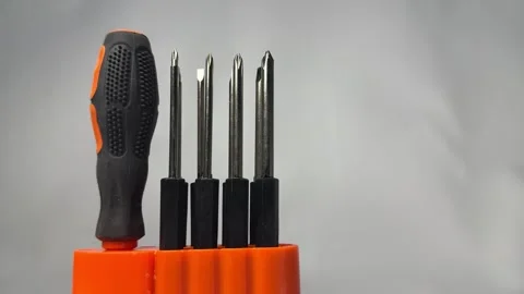 Precision screwdriver set with interchangeable bits in orange holder Stock Footage 345858661