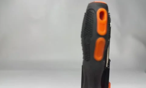 Precision screwdriver set with interchangeable bits in orange holder Stock Footage 345858668