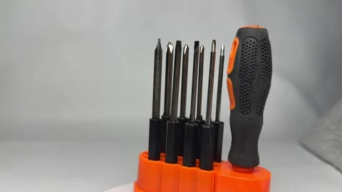 Precision screwdriver set with interchangeable bits in orange holder Stock Footage 345858688