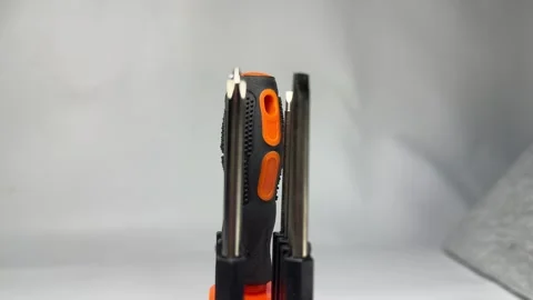 Precision screwdriver set with interchangeable bits in orange holder Stock Footage 345858689