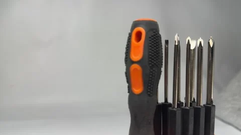 Precision screwdriver set with interchangeable bits in orange holder Stock Footage 345858692