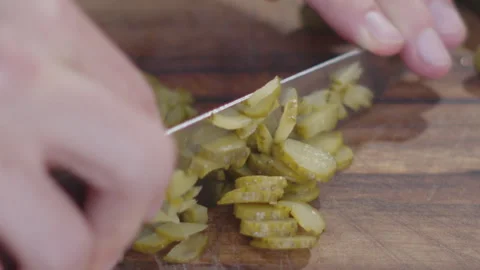 Precision Slices: Pickle Being Cut in Close-up Video stock 258299503