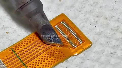 Precision Soldering on Smartphone Flex Cable Connector Stock Footage 333900085
