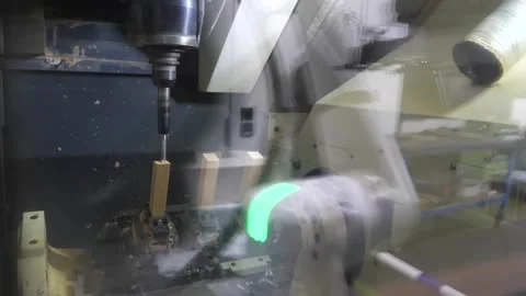 Precision Spindle Machining a Knife Blank Under Coolant Spray Stock Footage 340900225