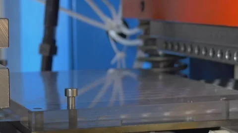 Precision Stamping Machine Performing Metal Panel Embossing in a Factory Setting Stock Footage 340486465