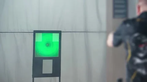 Precision in target practice at indoor range with expert marksman Video stock 308282959