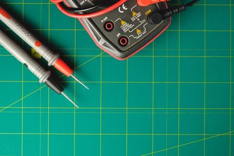 Precision tools for electrical measurements on a vibrant work surface Stock Photos