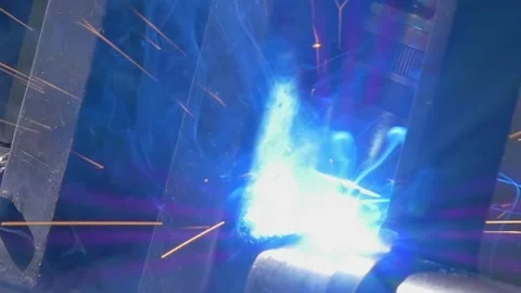 Precision Welding Magic With an Industrial Robot on Metal Pipes Stock Footage 340486690