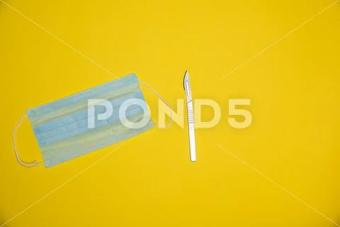 Precission sharp knife with sterile mouth face mask Stock Photos