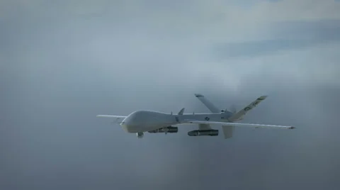 Predator drone flying in the clouds Stock Footage