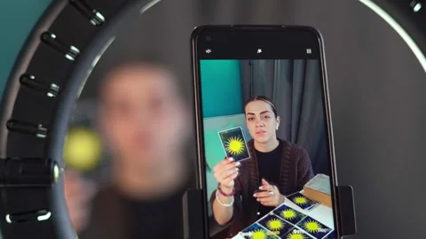 Predicting the future live. The fortune teller is broadcasting a fortune telling Stock Footage 253780520