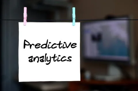 Predictive analytics. Note is written on a white sticker that hangs with a cl Stock Photos