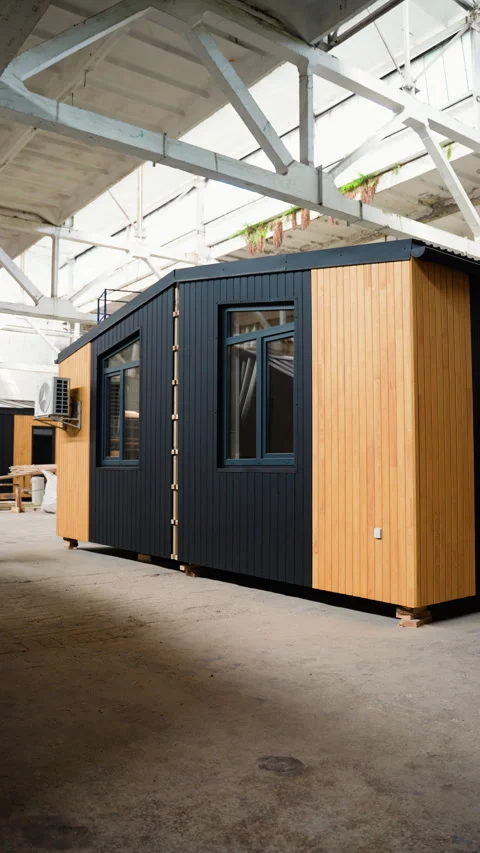 Prefabricated mobile modular container house in factory. Vertical video Stock Footage 277783267