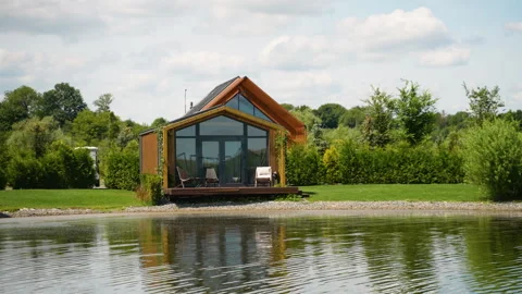 Prefabricated mobile modular container house outdoor near the lake and golf Stock Footage 282299155