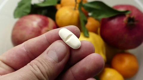 Preferring natural fruits and oranges instead of artificial vitamin pills, Stock Footage 166704853