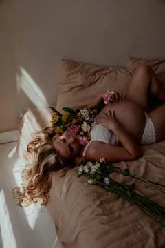 Pregnancy bally close up with tiny socks Stock Photos