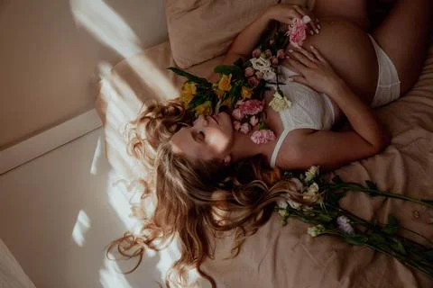 Pregnancy bally close up with tiny socks Stock Photos