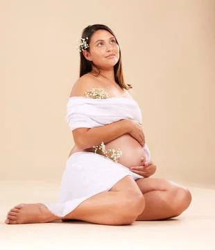 Pregnancy, pregnant woman with flowers sitting, beauty and glow isolated on Stock Photos
