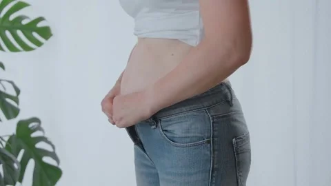 Pregnancy, problem with clothes size Stock Footage 283297874