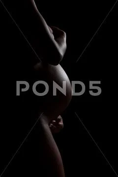 Pregnant african american woman body silhouette - black people Stock Photos