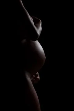 Pregnant african american woman body silhouette - black people Stock Photos
