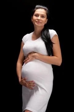 Pregnant on black background Stock Photos