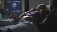 Pregnant Caucasian Couple Watching Ultrasound Stock Footage