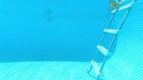 Pregnant goes down to the pool Stock Footage 65795208