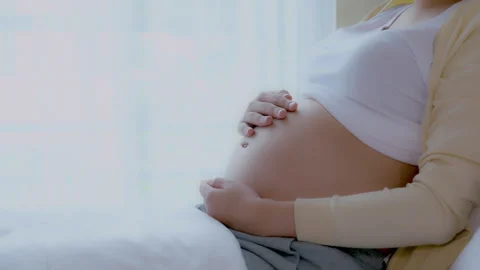 Pregnant touch belly close up Stock Footage 265860341