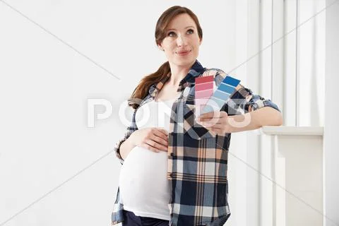 Pregnant Woman Choosing Color Scheme Fort Baby's Room Stock Photos