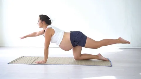 Pregnant woman doing sport exercises Yoga Stock Footage