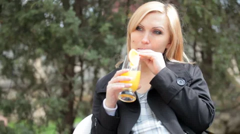 Pregnant woman drinking orange juice Stock Footage