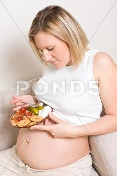 Pregnant woman eating sweet , salt and sour Stock Photos