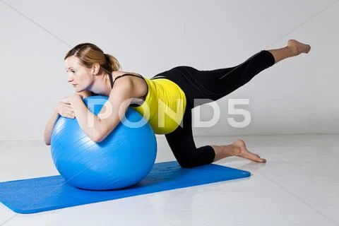 Pregnant woman exercising with fitness ball Stock Photos