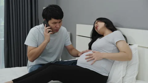 pregnant woman has a stomach ache while | Stock Video | Pond5