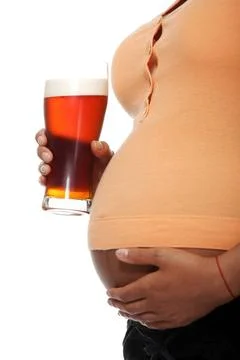 Pregnant woman holding glass full of alcohol Pregnant woman holding glass ... Stock Photos