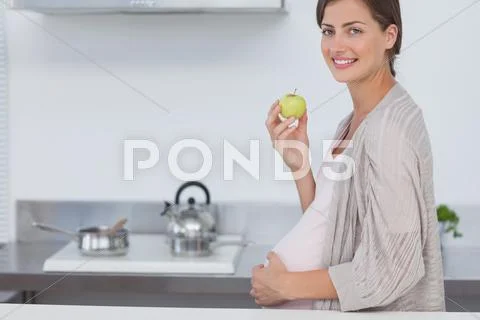 Pregnant woman holding her belly Stock-Fotos