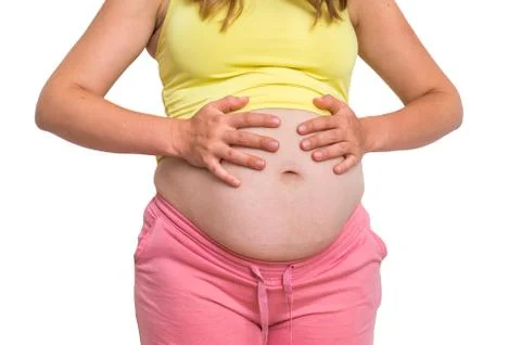 Pregnant woman with stomach ache - heartburn and pregnancy concept Stock Photos