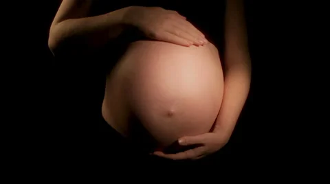 Pregnant woman strokes tummy (HD) Stock Footage
